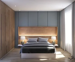 Bedroom interior with wardrobes on the sides