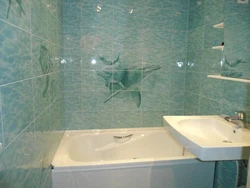 Bathroom renovation with panels and tiles photo