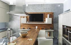 Corner Kitchen With TV On The Wall Photo In The Interior