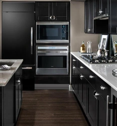 Black household appliances in the kitchen interior