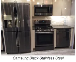 Black household appliances in the kitchen interior