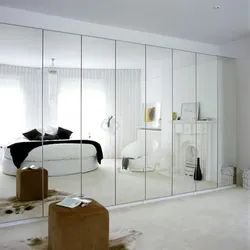 Bedroom interiors with mirrored wardrobe