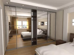 Bedroom interiors with mirrored wardrobe