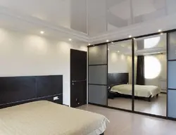 Bedroom interiors with mirrored wardrobe