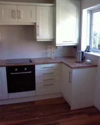 Kitchen design with gas boiler by the window