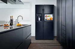 Refrigerator in the corner kitchen photo in the interior