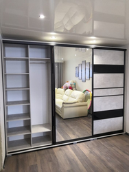 Built-in wardrobe in the living room along the entire wall photo inside