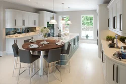 Island in the kitchen photo with dining area