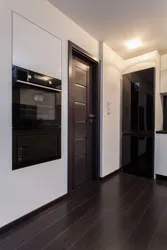 Light hallway interior with dark doors