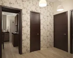 Hallway design with dark doors