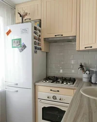 Interior in a Khrushchev-era kitchen 6 sq m design with a refrigerator