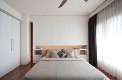 Interior of a small bedroom with one bed