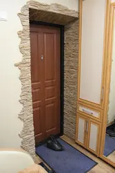 Finishing Doors With Decorative Stone In The Hallway Photo