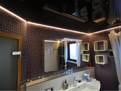 Bathtub with black suspended ceiling photo