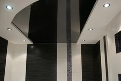 Bathtub with black suspended ceiling photo