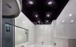 Bathtub with black suspended ceiling photo