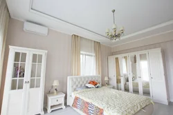 Matte white stretch ceiling in the bedroom photo