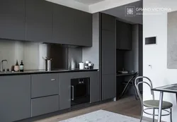 Photo Of A Kitchen With A Black Countertop And A Black Refrigerator