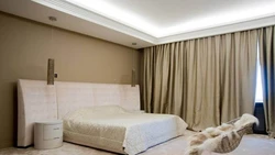 Ceiling cornice in the bedroom interior photo