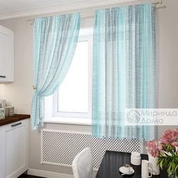 Mint curtains in the kitchen interior photo