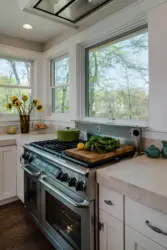 Kitchen interior stove by the window