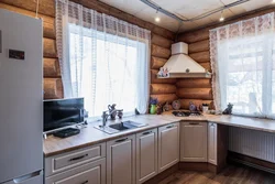 Window design in the kitchen in a wooden house