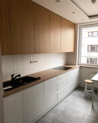 White kitchens up to the ceiling with wood photo