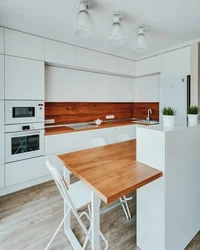 White kitchens up to the ceiling with wood photo