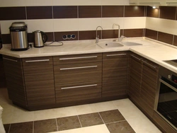 Kitchen design brown tiles on the floor