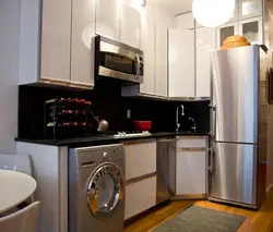Small kitchen with machine and refrigerator design