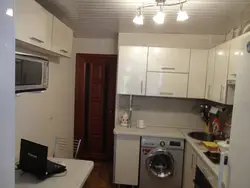 Small kitchen with machine and refrigerator design