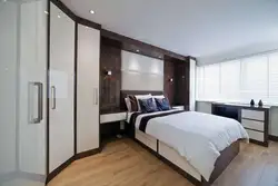 Bedroom design with large wardrobe and bed