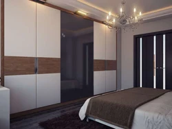 Bedroom design with large wardrobe and bed
