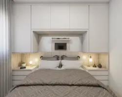 Bedroom design with large wardrobe and bed