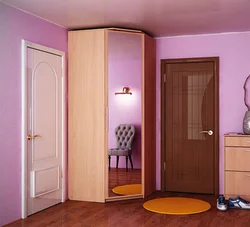 Corner wardrobe in the hallway with a mirror photo design