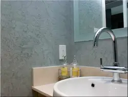Decorative plaster for walls in the bathroom interior photo
