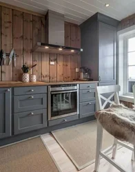 Gray kitchen with wooden facades interior