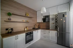 Gray kitchen with wooden facades interior