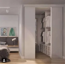 Dressing room design in a bedroom 15 sq.m.