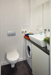 Narrow bathroom design with washing machine