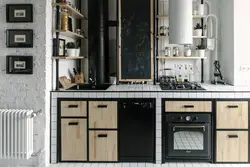 Photo of a kitchen with pipes in an apartment