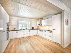 White kitchen in a wooden house design