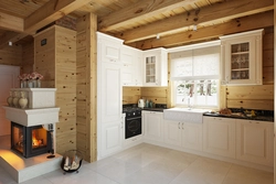 White kitchen in a wooden house design