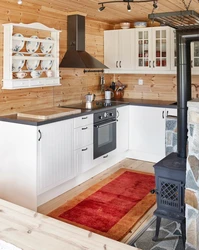 White kitchen in a wooden house design