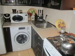 Small kitchen design with washing machine and refrigerator