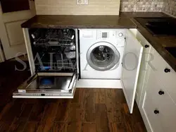 Photo of a kitchen with a dishwasher and washing machine photo