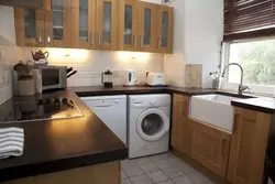 Photo of a kitchen with a dishwasher and washing machine photo