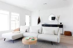 Living room with round sofa interior photo