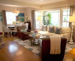 Living room with round sofa interior photo