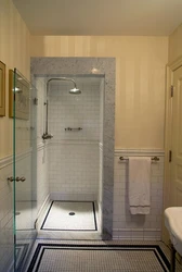 Bathtub and shower without tray in one room design